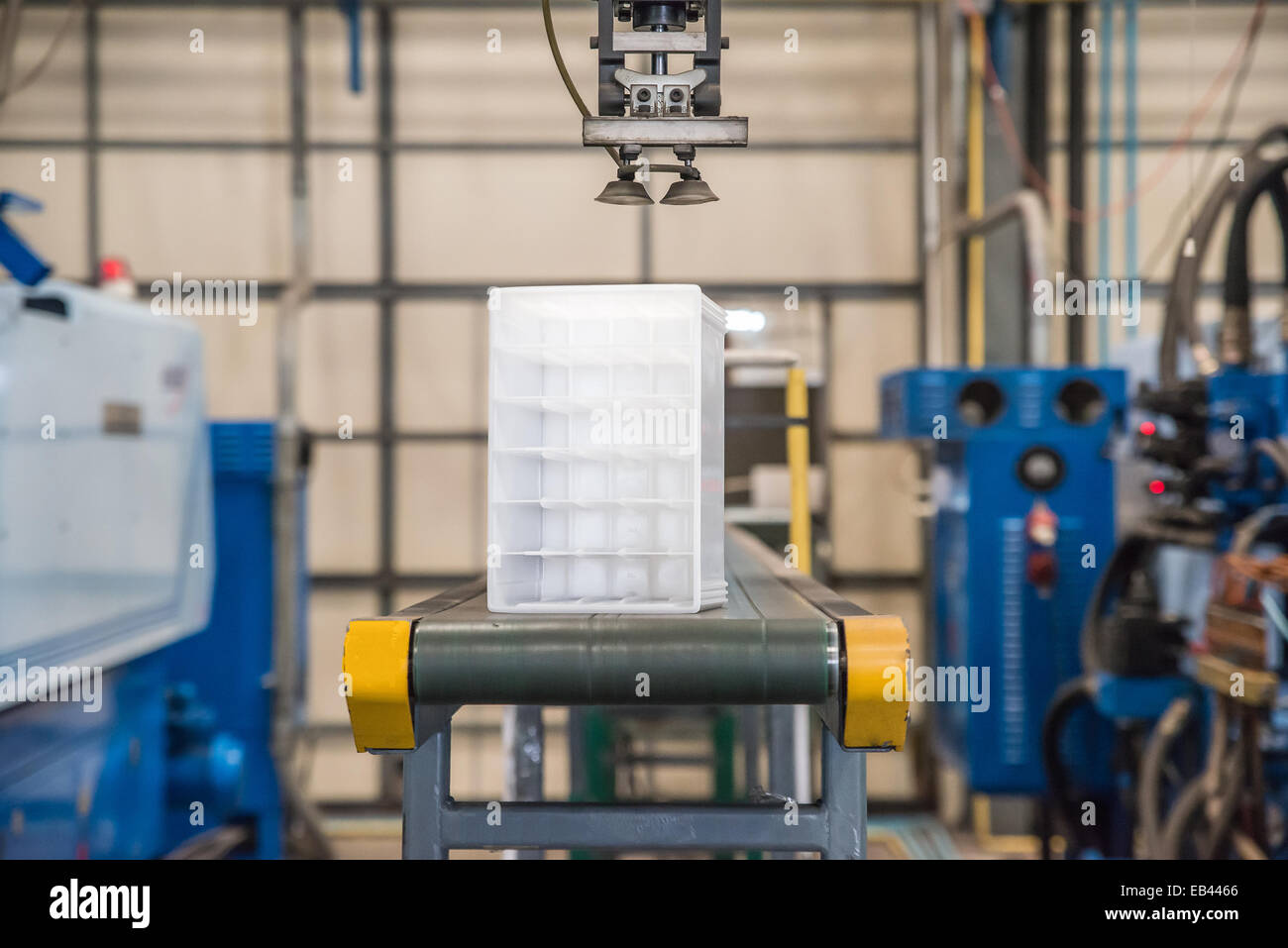 Industrial robot working in factory Stock Photo