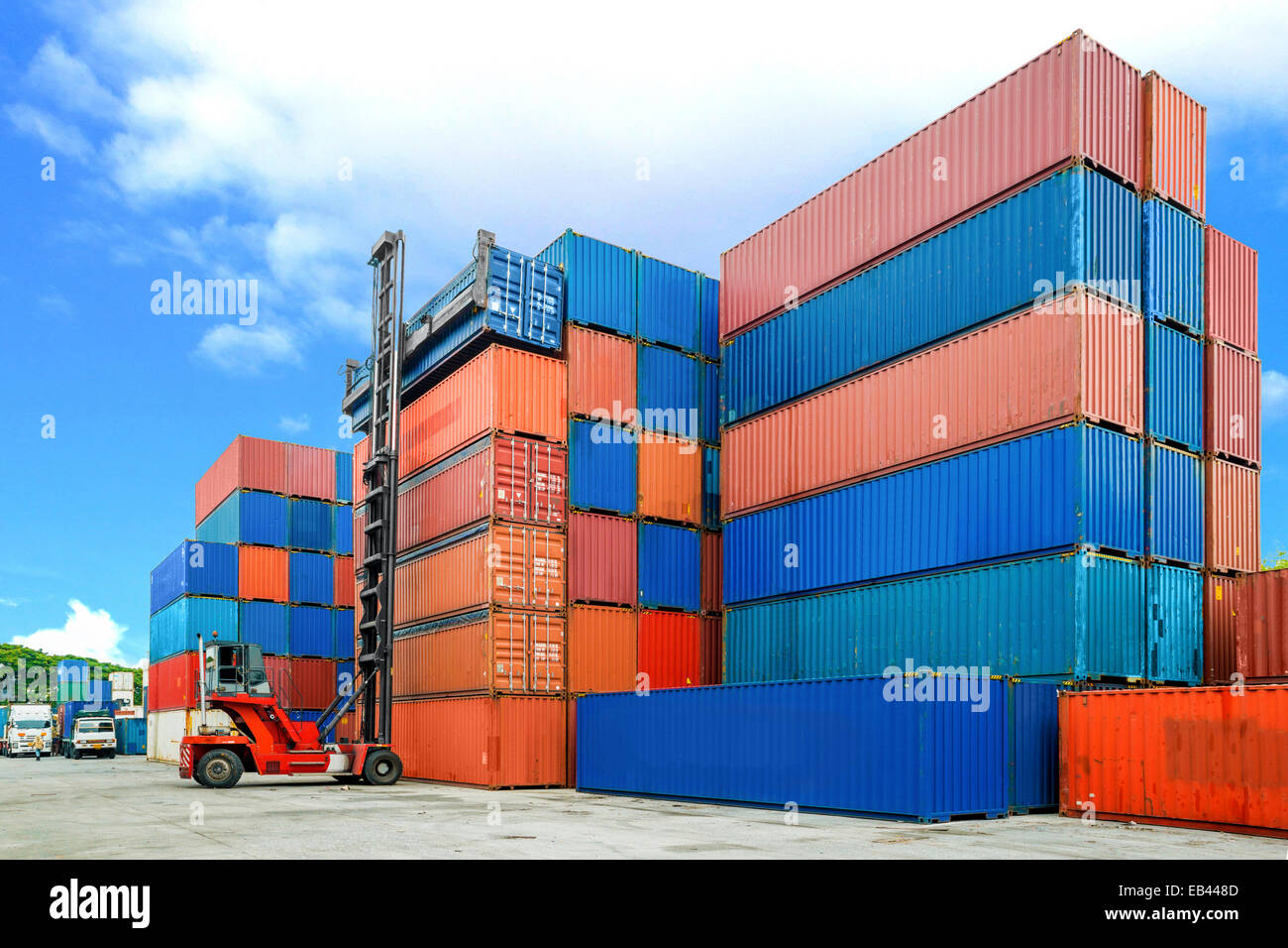 Crane lifter handling container box loading to depot Stock Photo