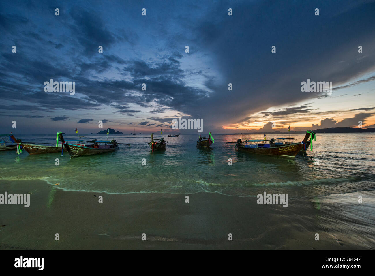 longtail boats at sunset, Ao Nang, Thailand Stock Photo