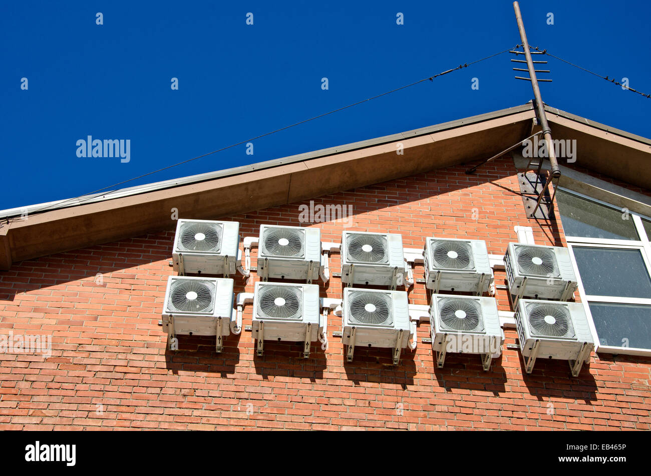 air conditioning equipment on red brick house wall Stock Photo Alamy