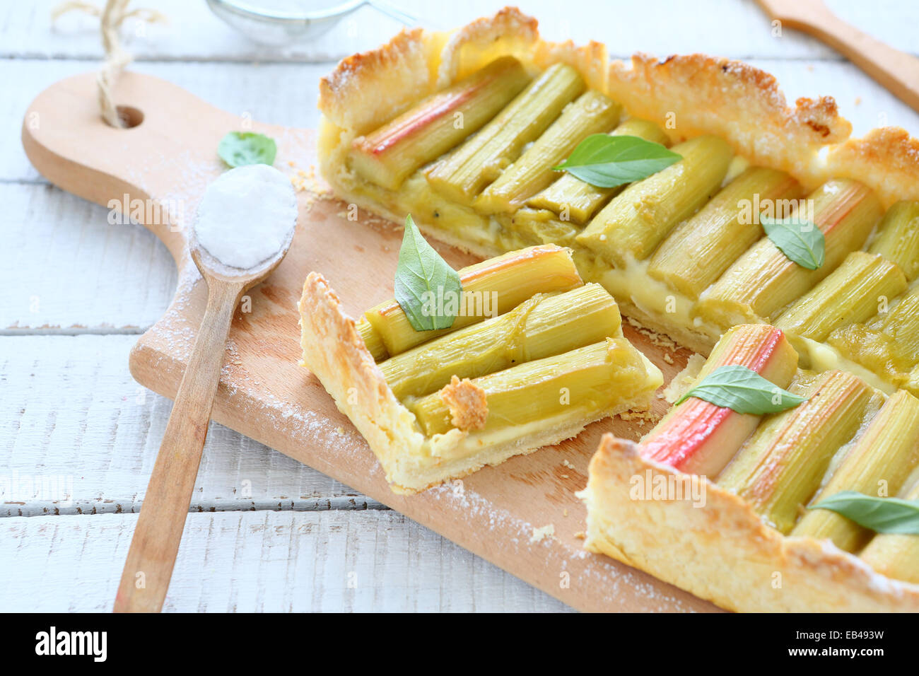 Slices of pie with rhubarb on a cutting board, tasty food Stock Photo