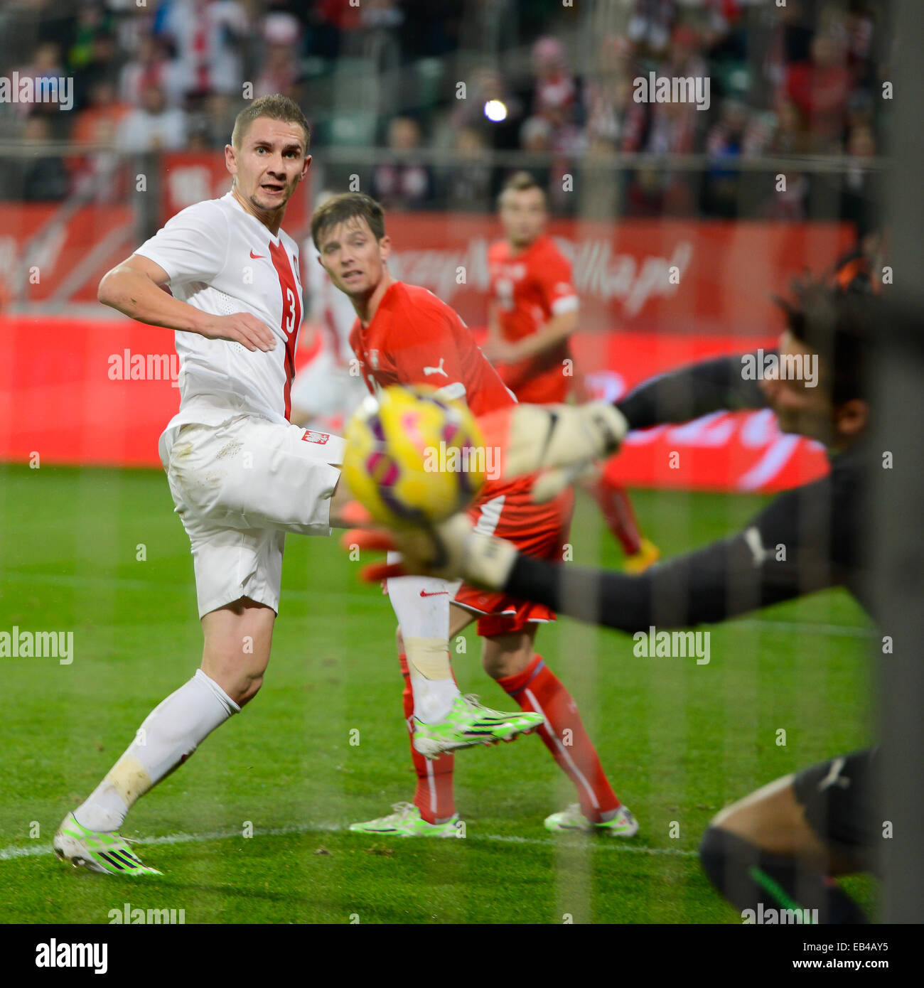 WROCLAW, POLAND - NOVEMBER 18, 2014: Artur Jedrzejczyk shotting a goal during match Poland -  Switzerland 2:2. Stock Photo