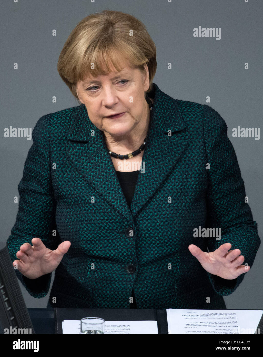 Berlin, Germany. 26th Nov, 2014. Chancellor Angela Merkel speaking in the German Bundestag in Berlin, Germany, 26 November 2014. The Bundestag is debating the 2015 federal budget, starting with the budget of the Federal Chancellery. In connection with the 4-hour long general debate on government policy, the budgets for the Ministry of Foreign Affairs, the Ministry of Defence, and the Ministry for Economic Cooperation and Development will be discussed. Credit:  dpa picture alliance/Alamy Live News Stock Photo