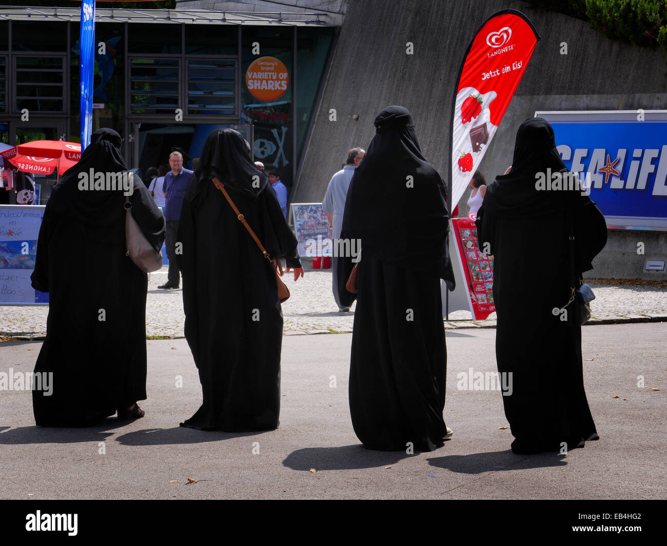 Arab Saudi Arabian Women tourists in traditional black Burka in Olympia Park Munich Germany Europe Stock Photo