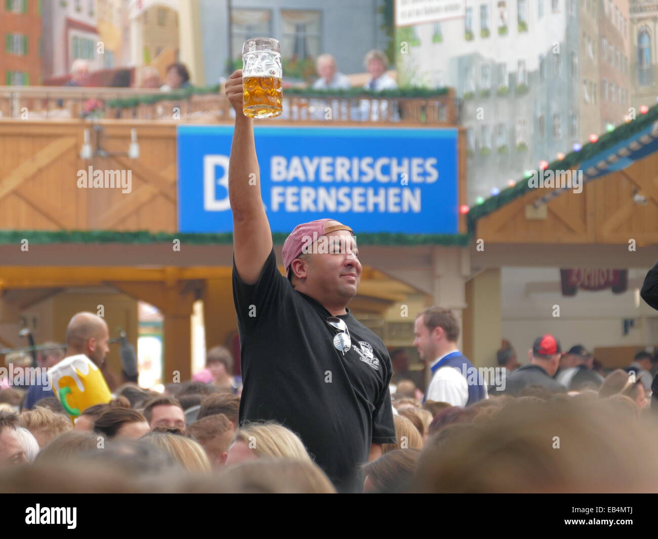 Germany Munich Beer Festival Oktoberfest Octoberfest Fairground 2014 Happy man just drunk his Mass beer and satisfy. Stock Photo