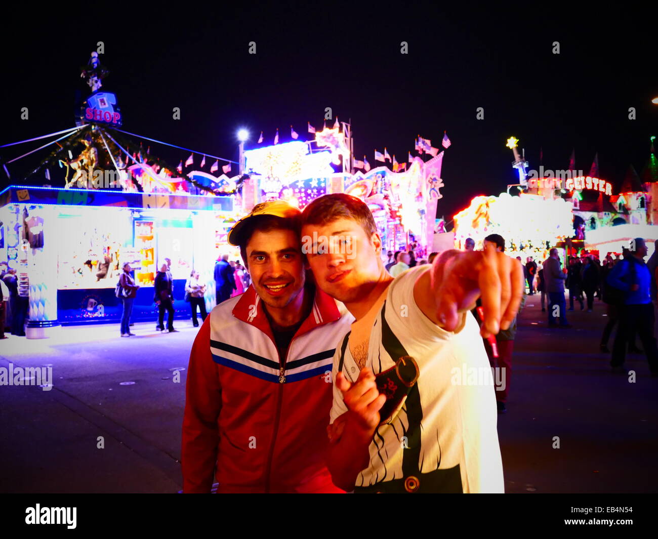 Germany Munich Beer Festival Oktoberfest Octoberfest Fairground 2014 Visitors happy mood by Beer Alcohol posing in front of came Stock Photo