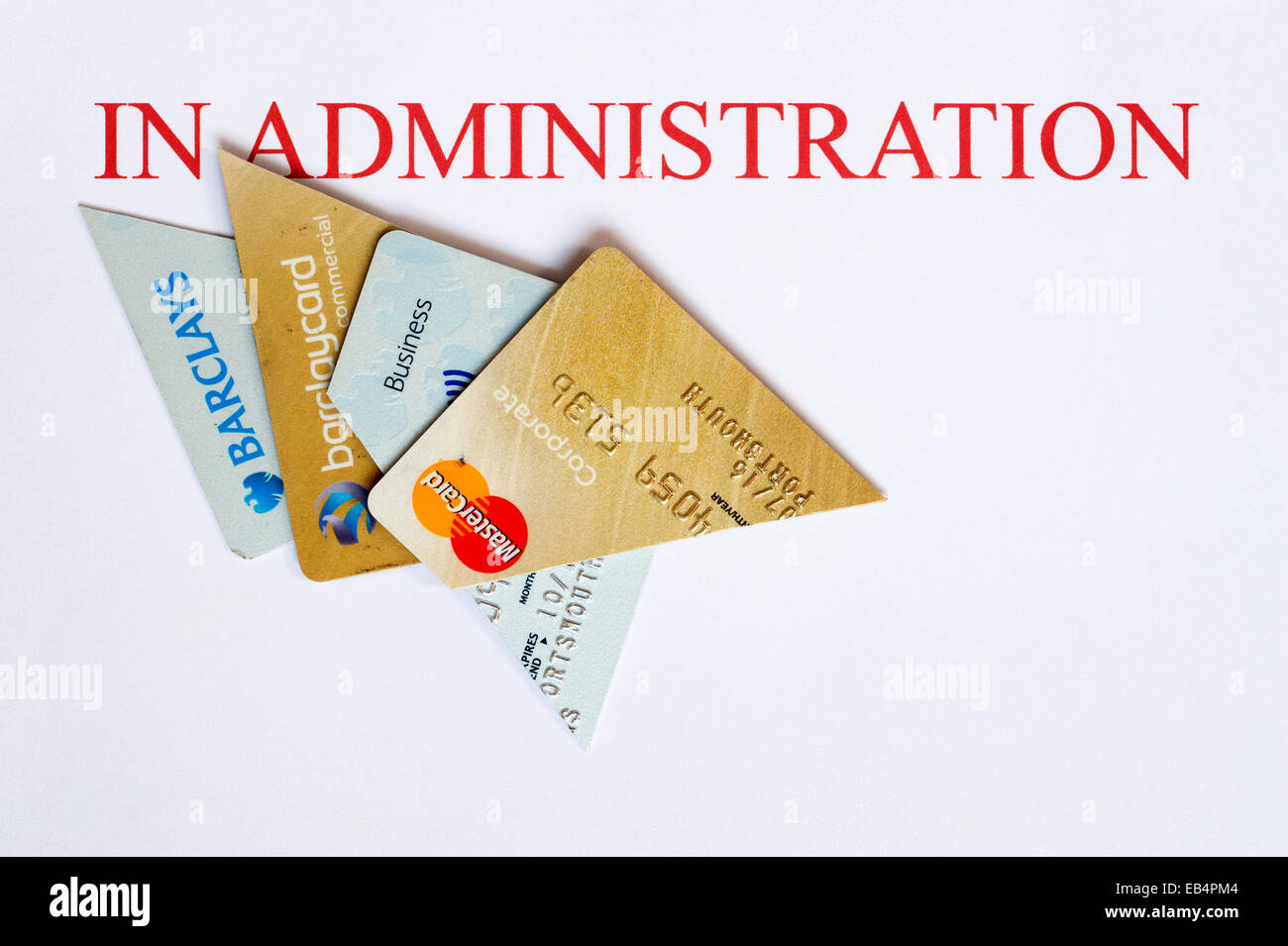 cut up business credit and bank cards on a letterhead of in administration Stock Photo