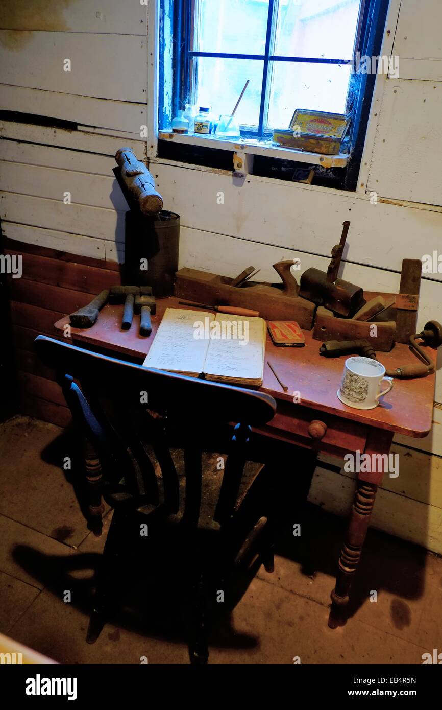 Old boats builders office desk and ledger on display inside the