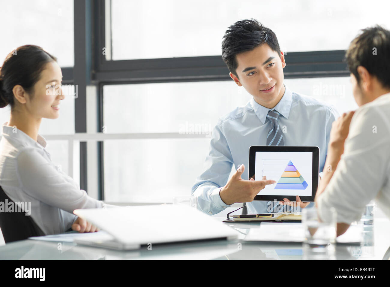 Young business people using digital tablet in office Stock Photo