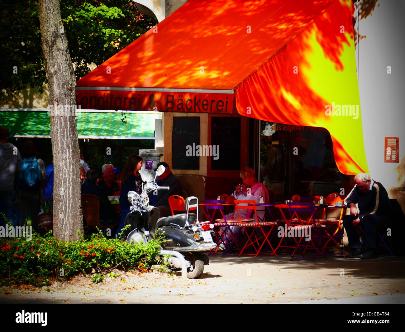 Local Bakery shop with tables and chairs outside serving coffee and cakes Stock Photo