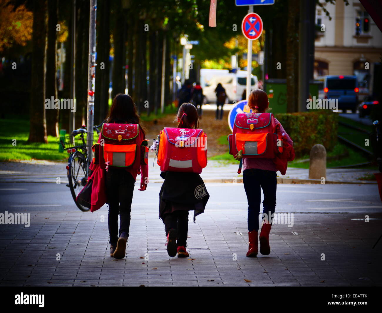 After School Children Kids going home in Autumn leaves color Stock Photo