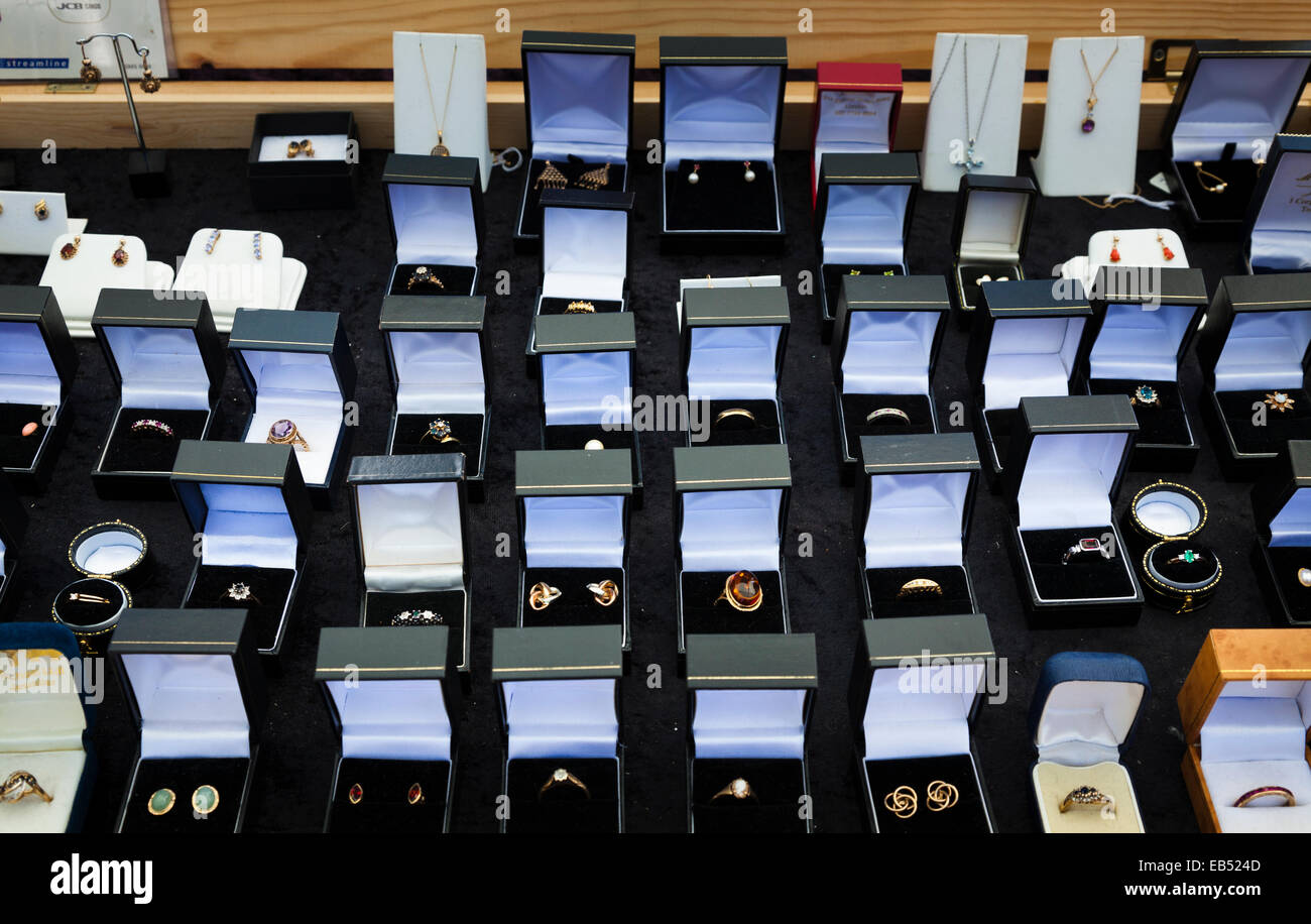 Display of rings for sale in boxed on market stall Stock Photo
