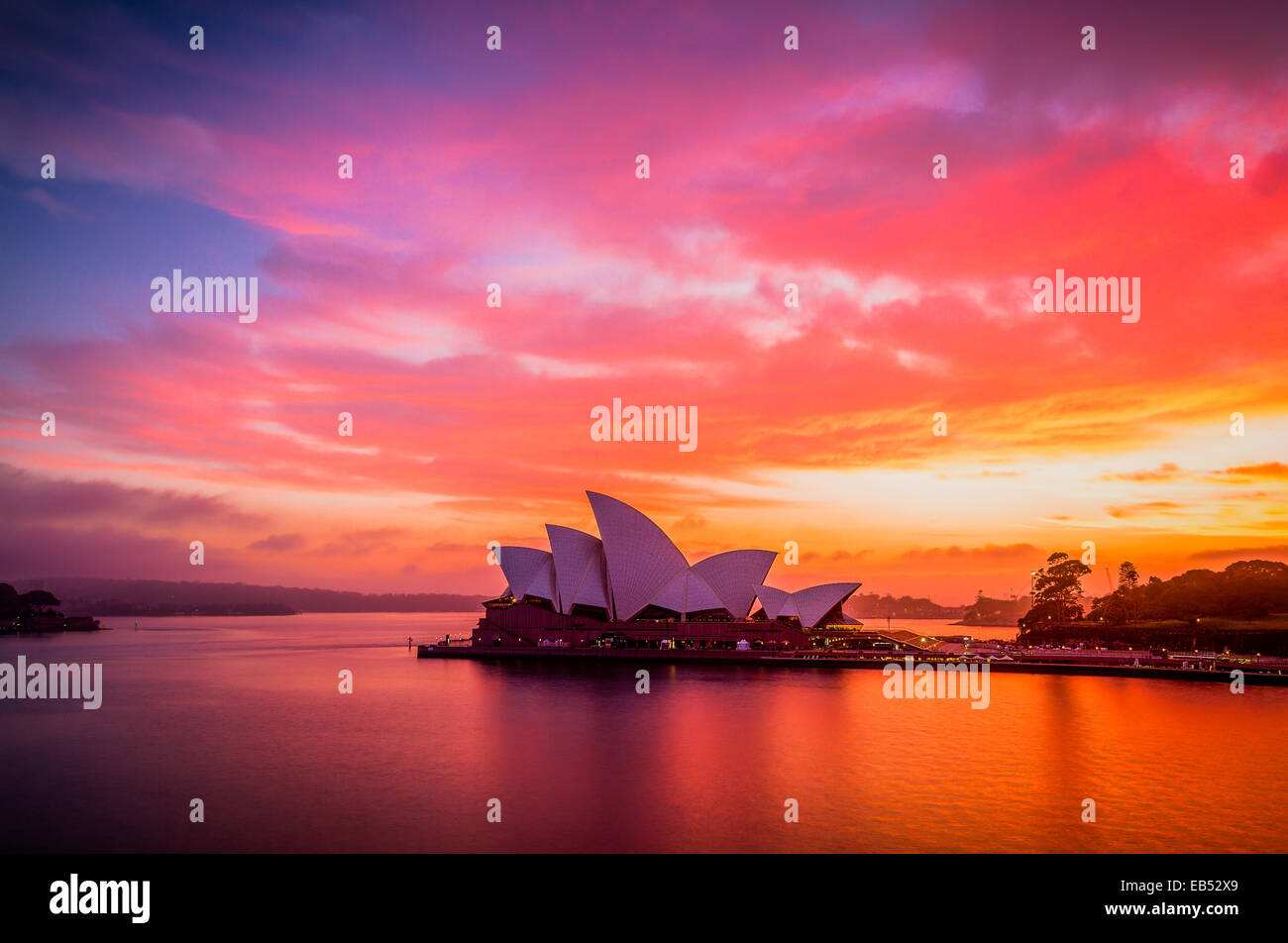A gloriously vivid sunrise sky above the Sydney Opera House Stock Photo