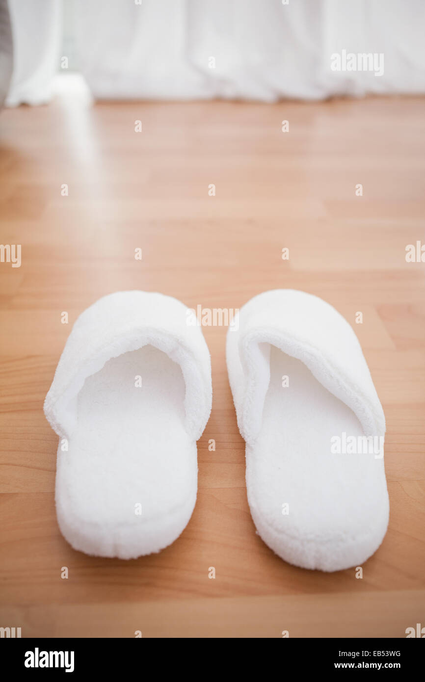 Fluffy slippers on the floor Stock Photo