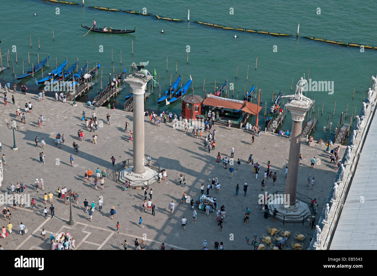 Columns of Lion of St Mark and Saint Theodore and gondalas from St ...