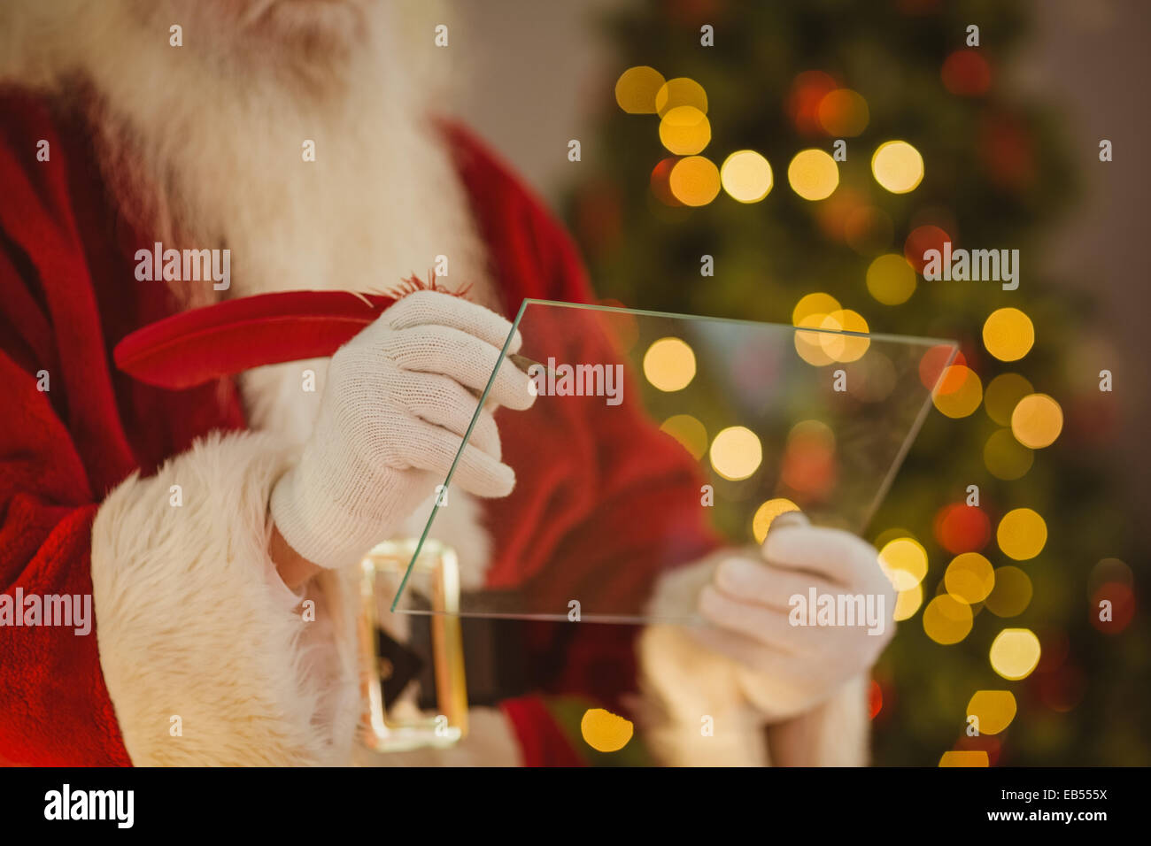 Santa claus writing list on the glass Stock Photo Alamy