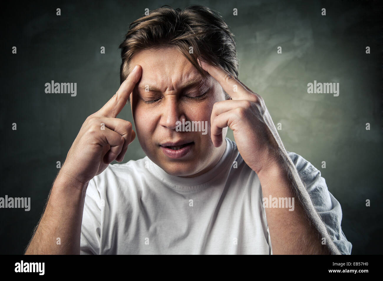 young handsome man doubting over gray background Stock Photo