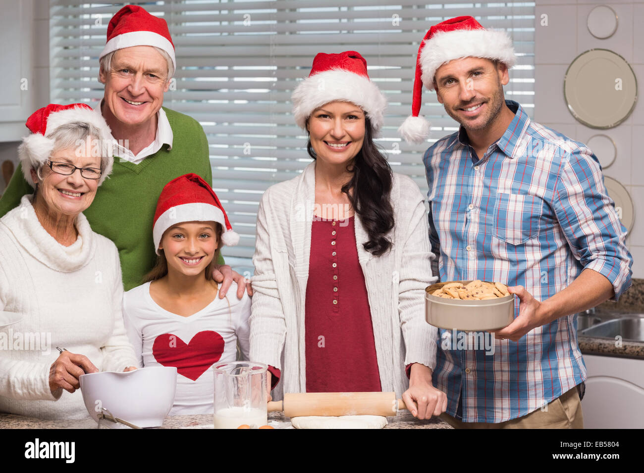 Multi-generation family baking together Stock Photo - Alamy