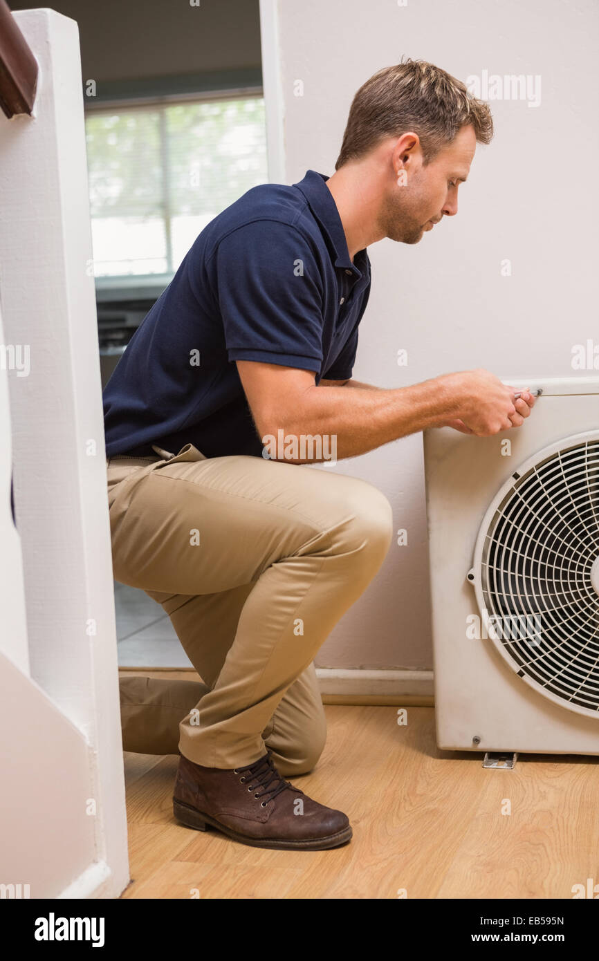 Focused Handyman Fixing Air Conditioning Stock Photo Alamy Focused handyman fixing air conditioning stock photo alamy