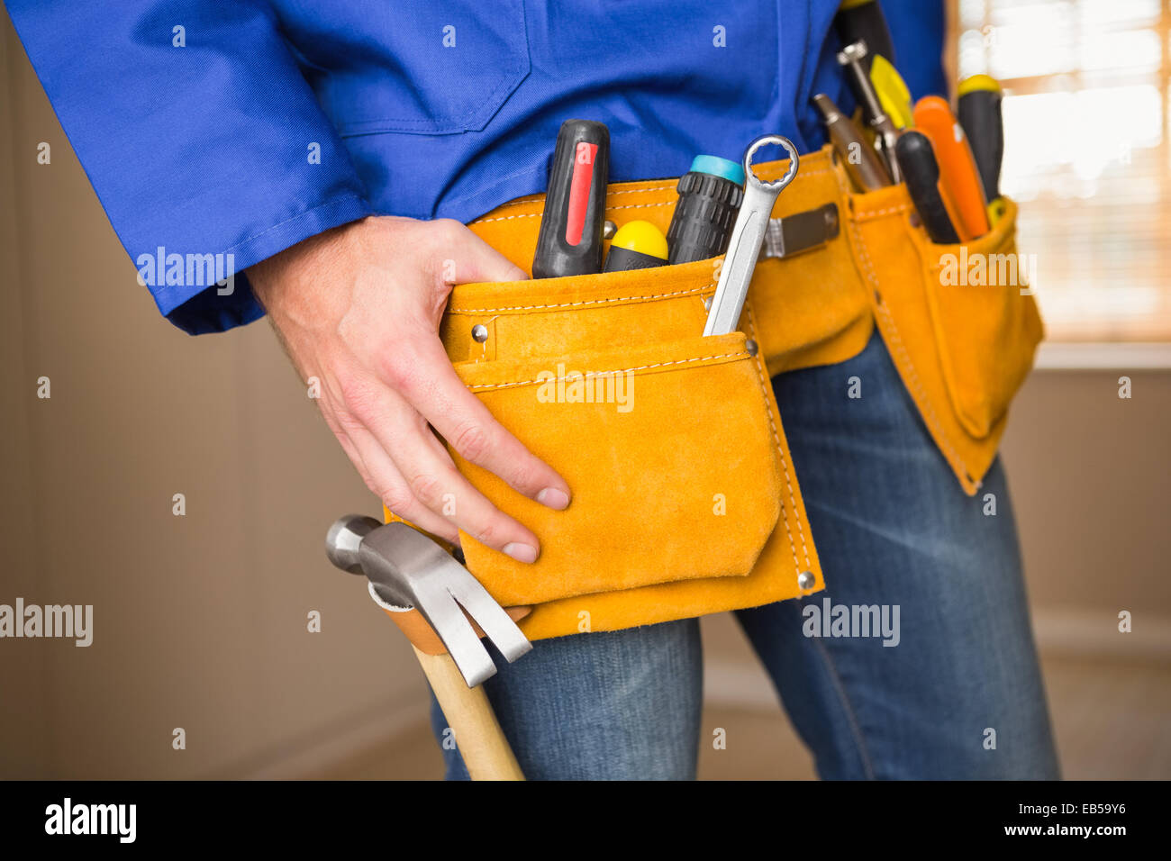 Close up of handyman in tool belt Stock Photo - Alamy