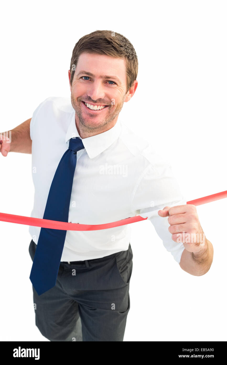 Businessman crossing the finish line Stock Photo Alamy