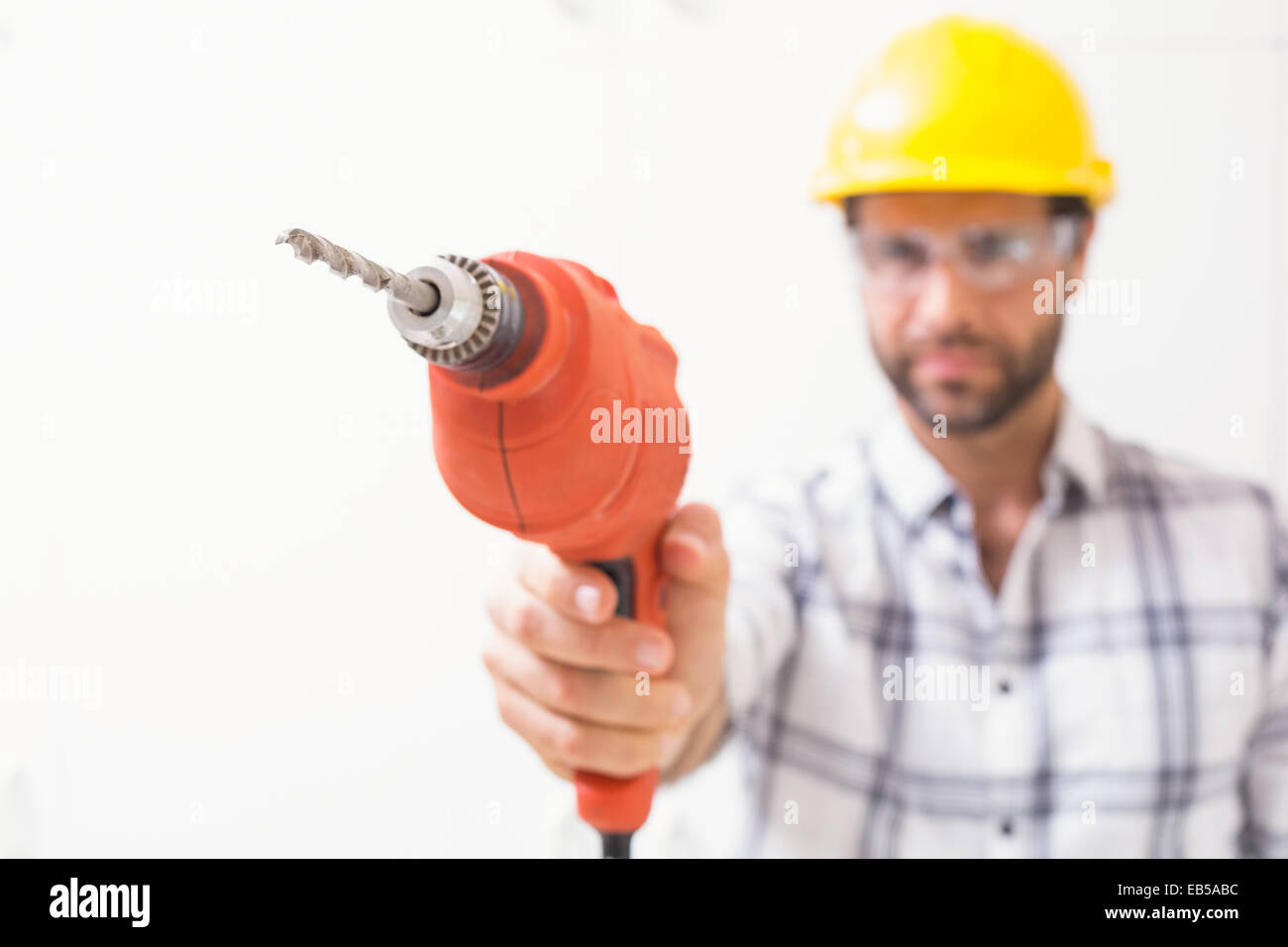 Construction worker holding power drill Stock Photo Alamy