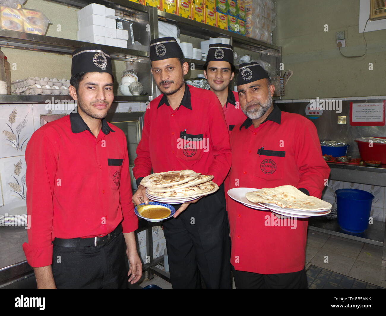 UAE Dubai Deira Pakistani restaurant waiters work as cheap labors in Dubai. 80% population are Indian Pakistan labors Stock Photo