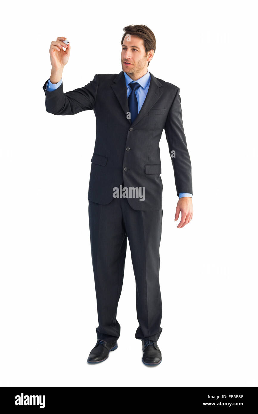 Young businessman writing with marker Stock Photo - Alamy