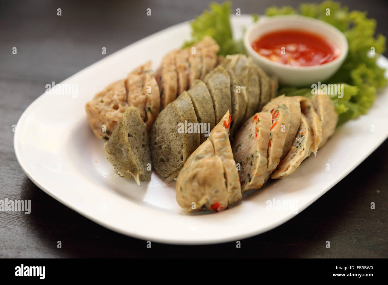 ''Mooyor'' or Vietnamese sausage pork with sauce on a plate Stock Photo