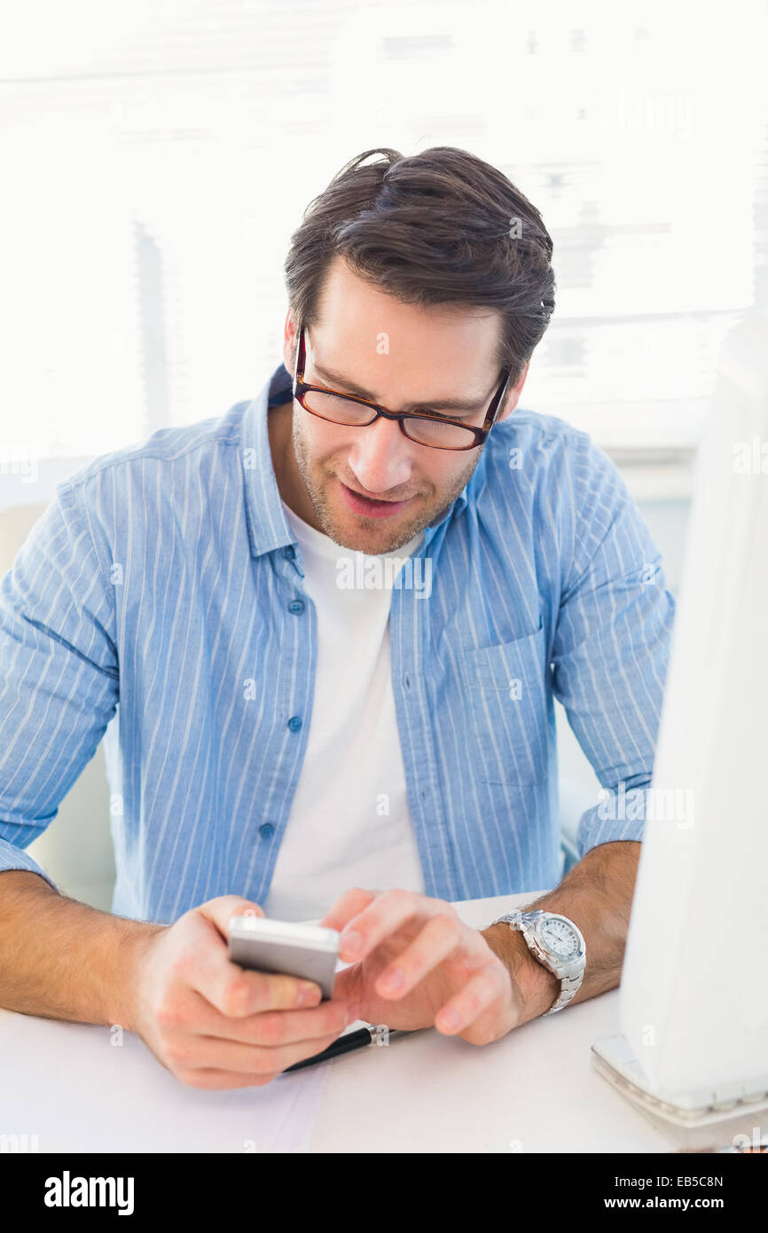 Male photo editor typing text message Stock Photo - Alamy