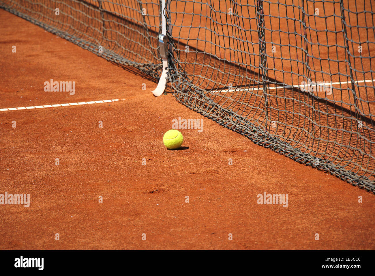 Tennis ball in front of the net on the tennis court Stock Photo Alamy