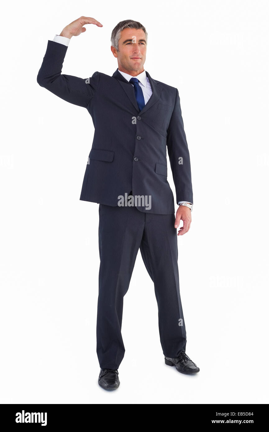 Cheerful businessman posing with arm up Stock Photo Alamy