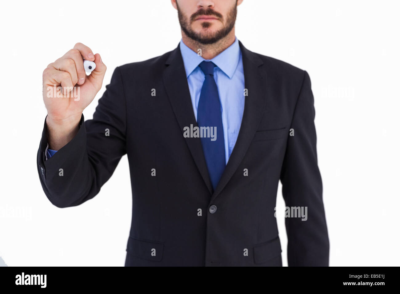 Focused businessman writing with marker Stock Photo - Alamy