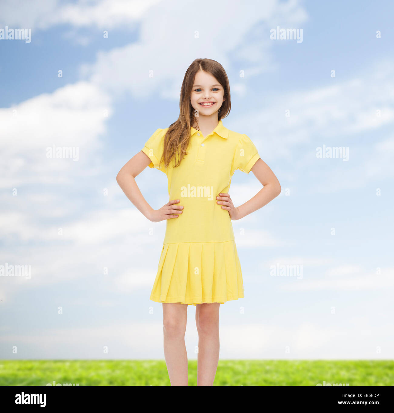 smiling little girl in yellow dress Stock Photo Alamy