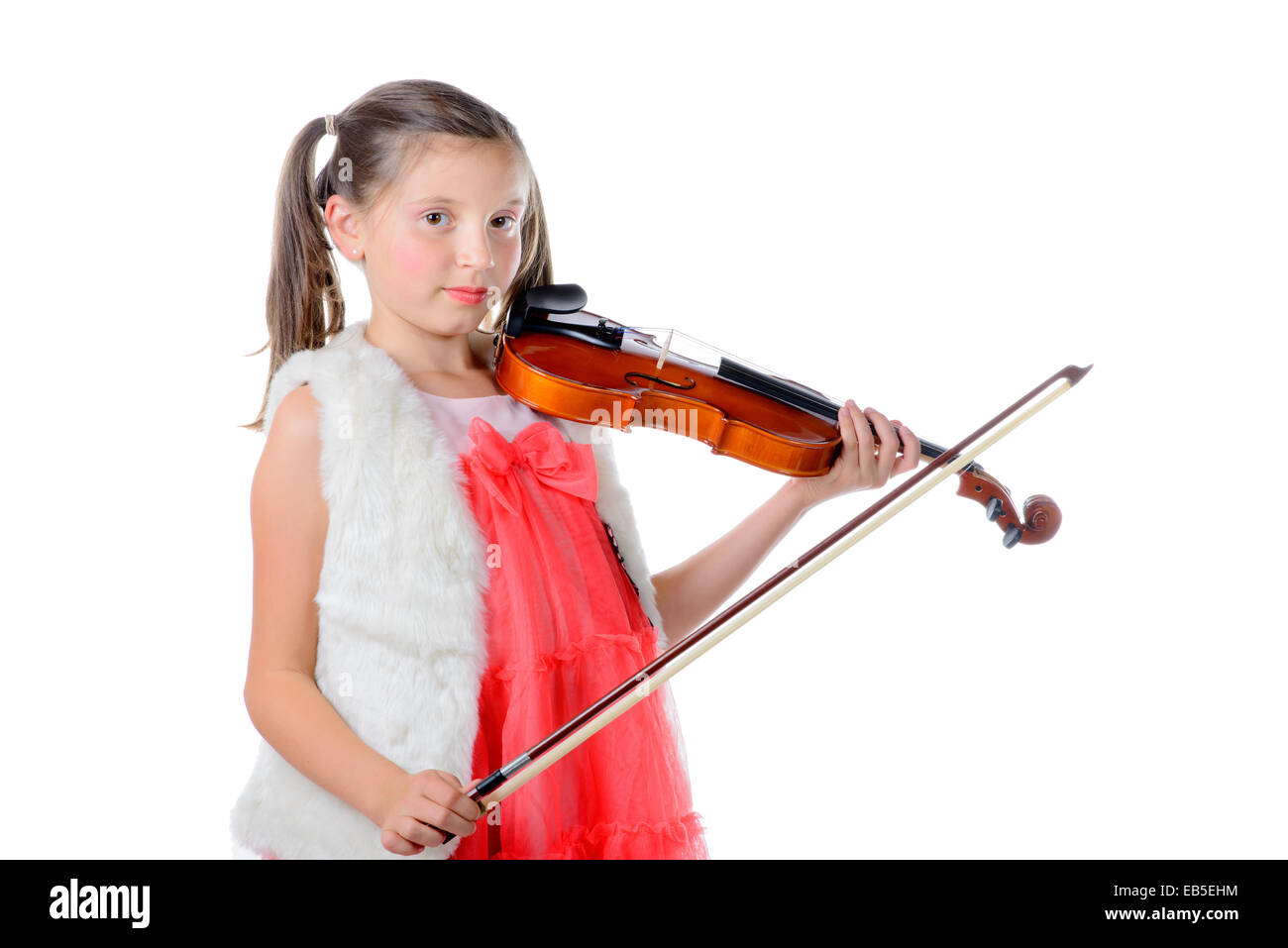 a pretty little girl playing the violin on the white background Stock Photo