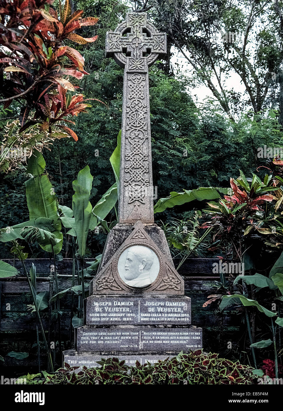An 1893 monument to famed Belgian missionary Father Damien stands in the isolated leper village of Kalaupapa on the island of Molokai in Hawaii, USA. Stock Photo