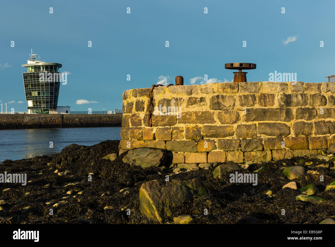 Old jetty, capstan and Marine Operations Control tower Stock Photo Alamy