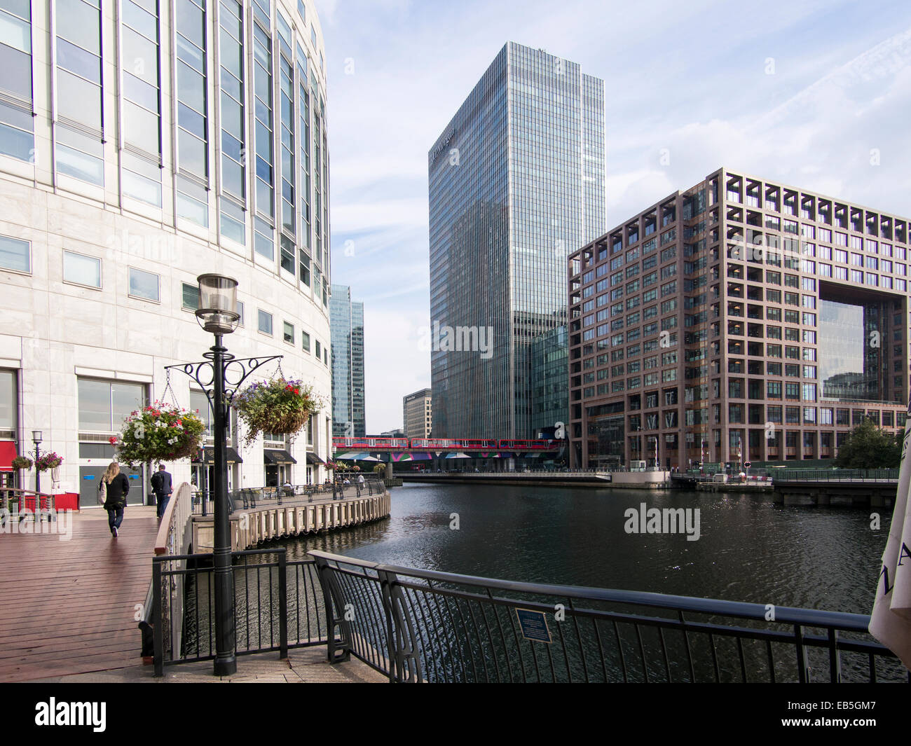 Canary Wharf Middle Dock and Docklands Light Railway London UK Stock Photo