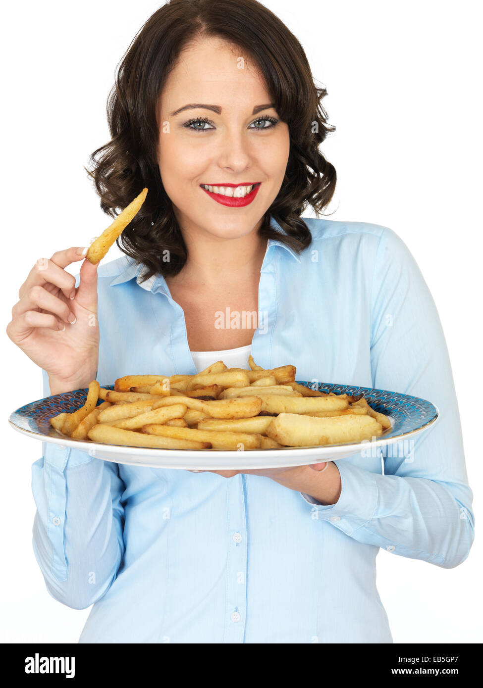 Attractive Young Woman Holding a Tray of Roast Parsnips Stock Photo