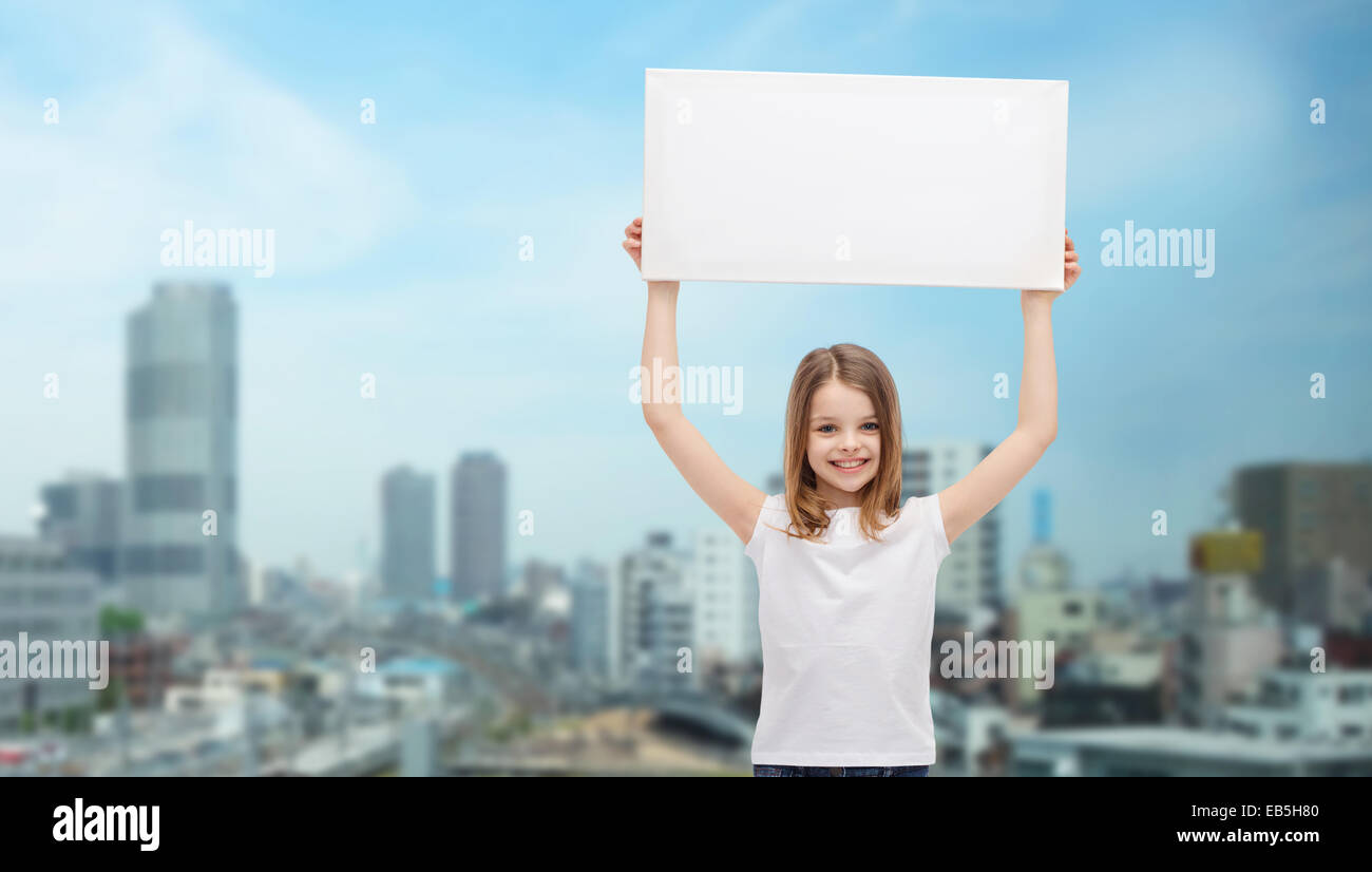 smiling little girl holding blank white board Stock Photo - Alamy
