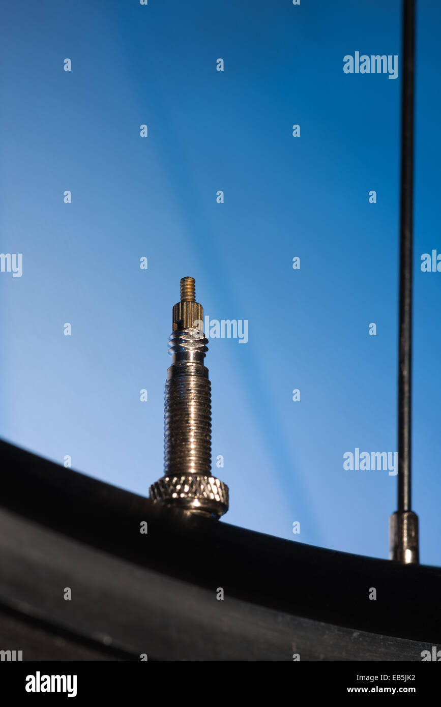 racing road bike wheel rim spokes and valve Stock Photo Alamy