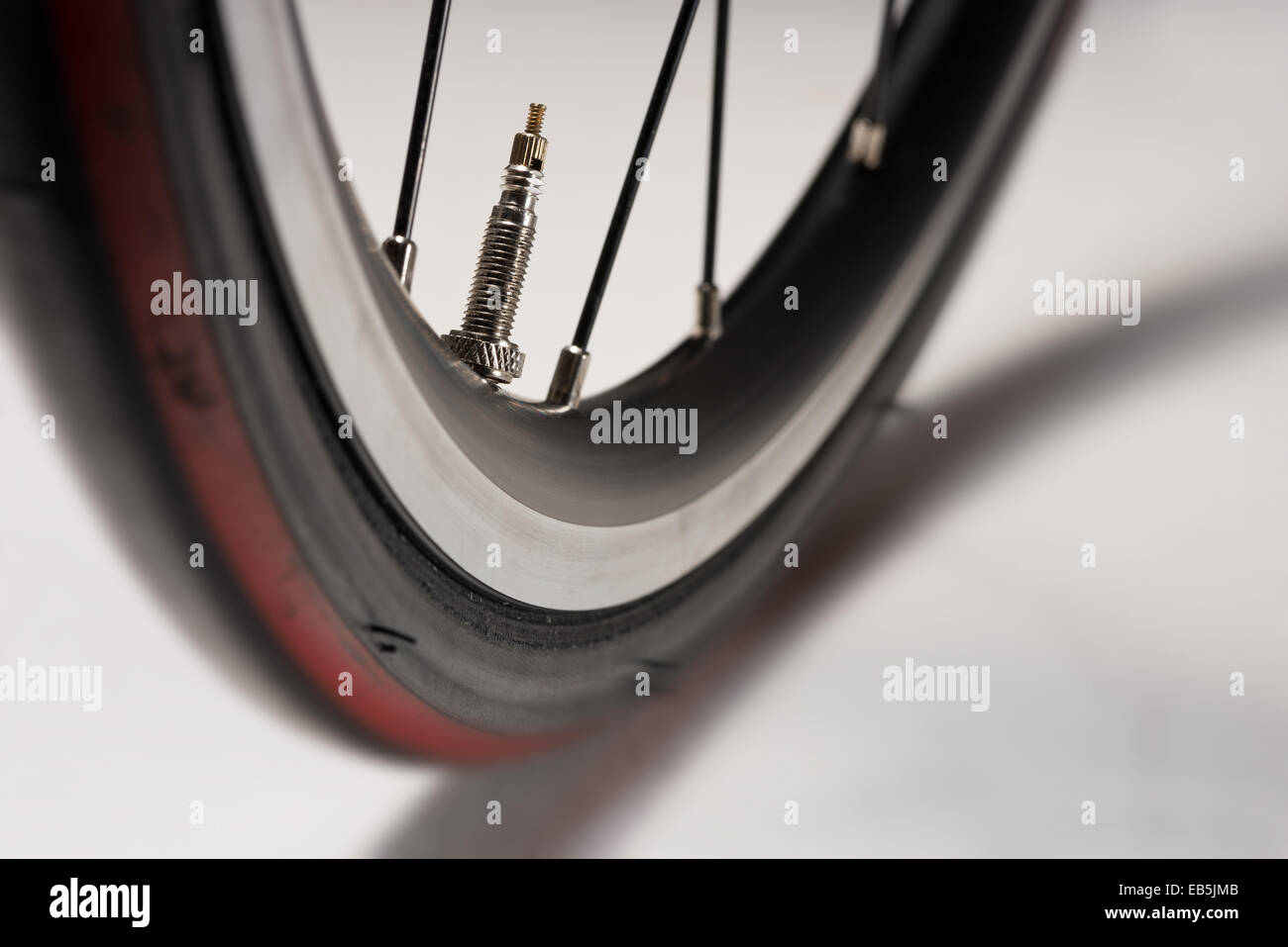 racing road bike wheel rim spokes and valve Stock Photo Alamy