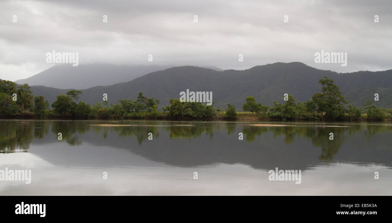 mountain reflections in the Daintree River on a cloudy day Stock Photo