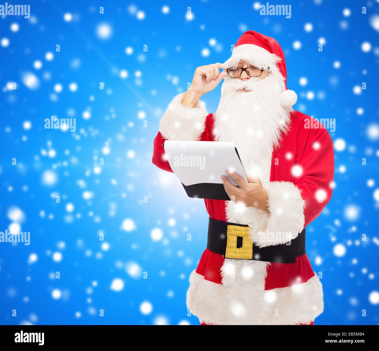 man in costume of santa claus with notepad Stock Photo - Alamy