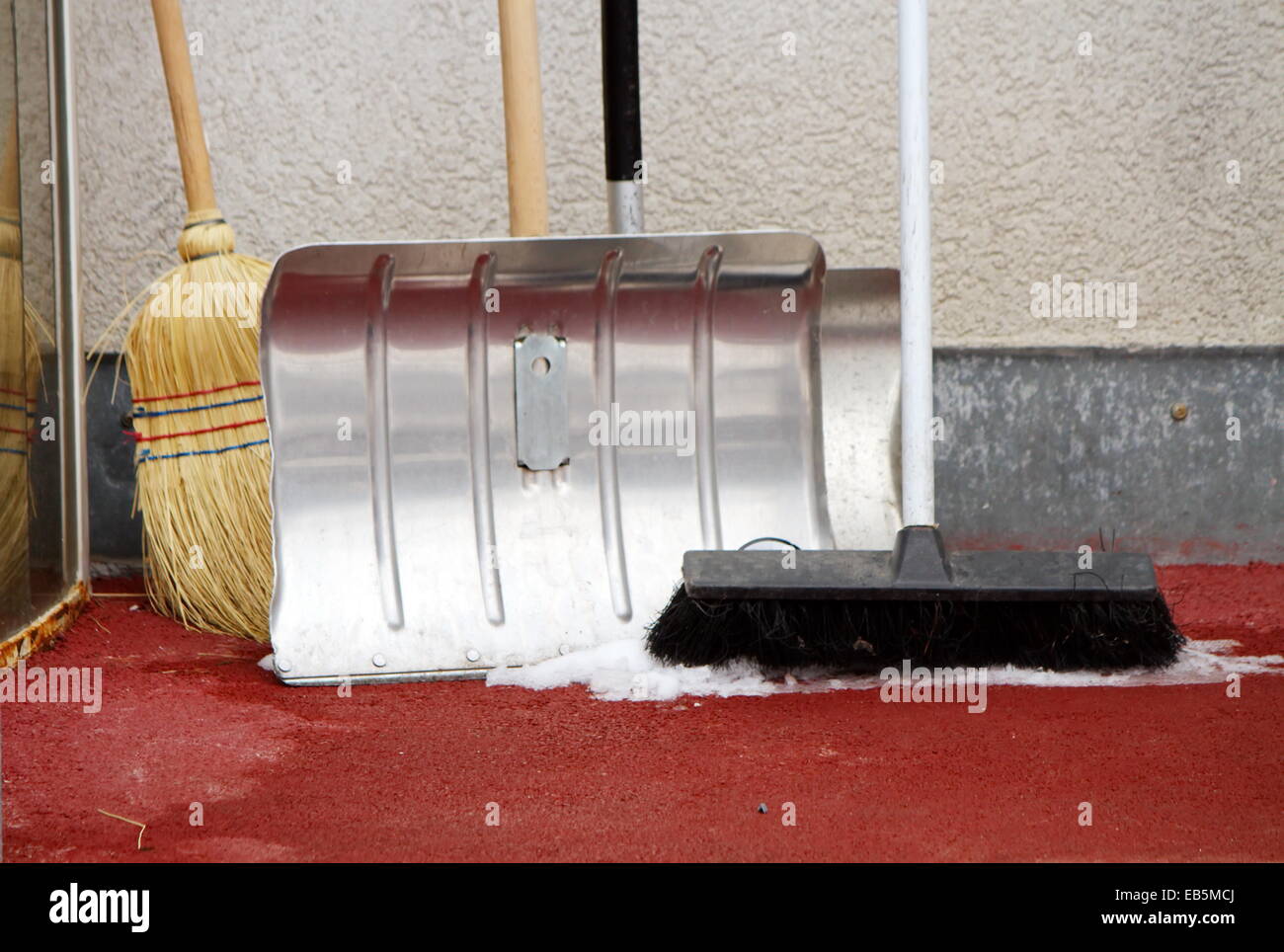 Close up on winter tools as shovel and broom to remove snow Stock Photo