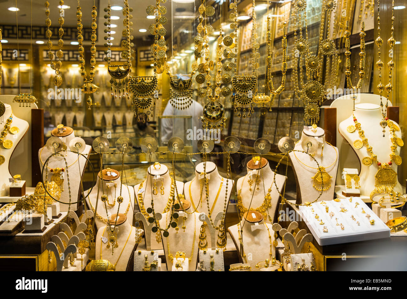 Gold jewelries displayed in a store window. Souq Muttrah, Muscat Stock ...