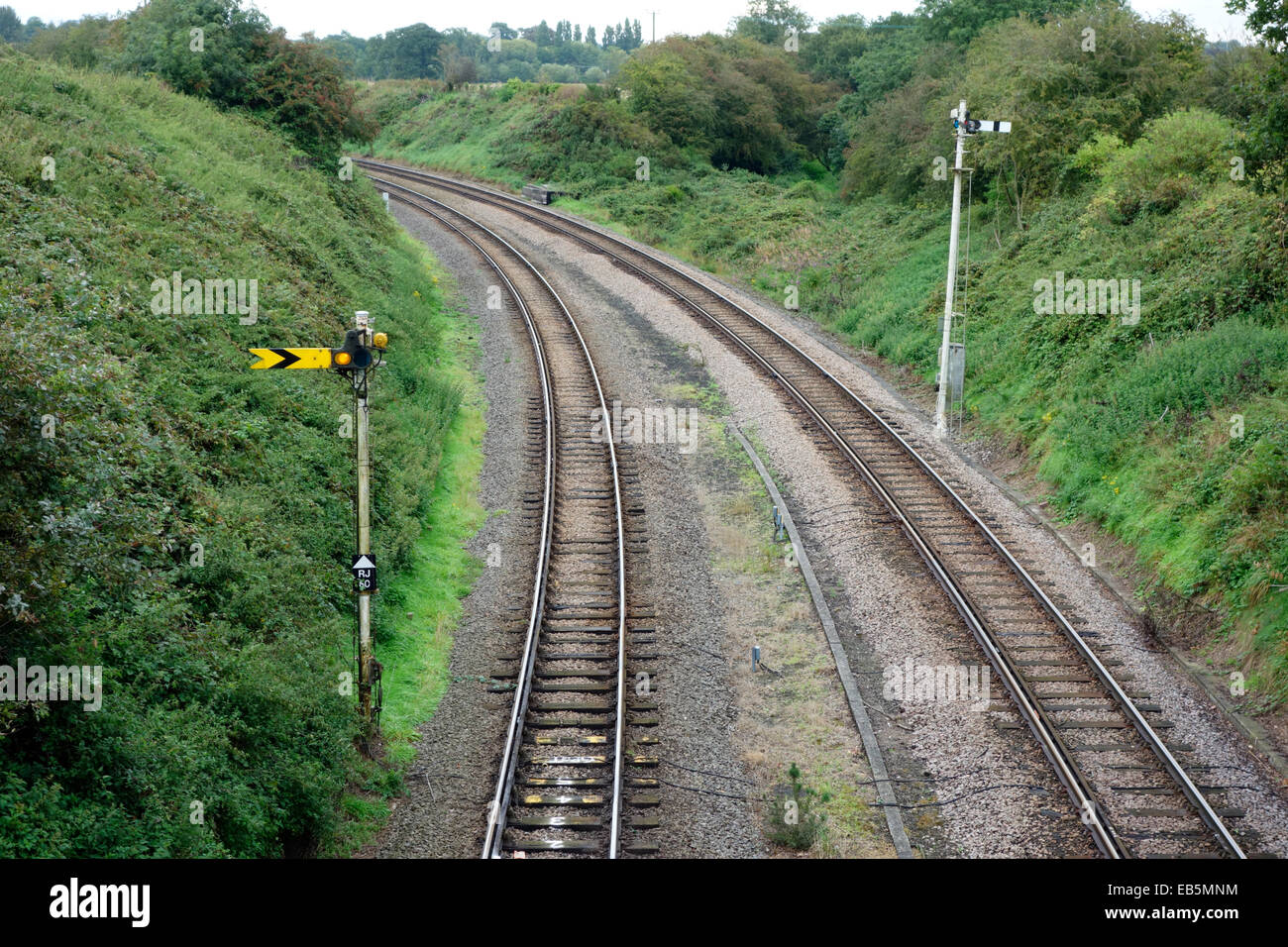 Railway signals leading away from the Reedham swing bridge, Norfolk Stock Photo