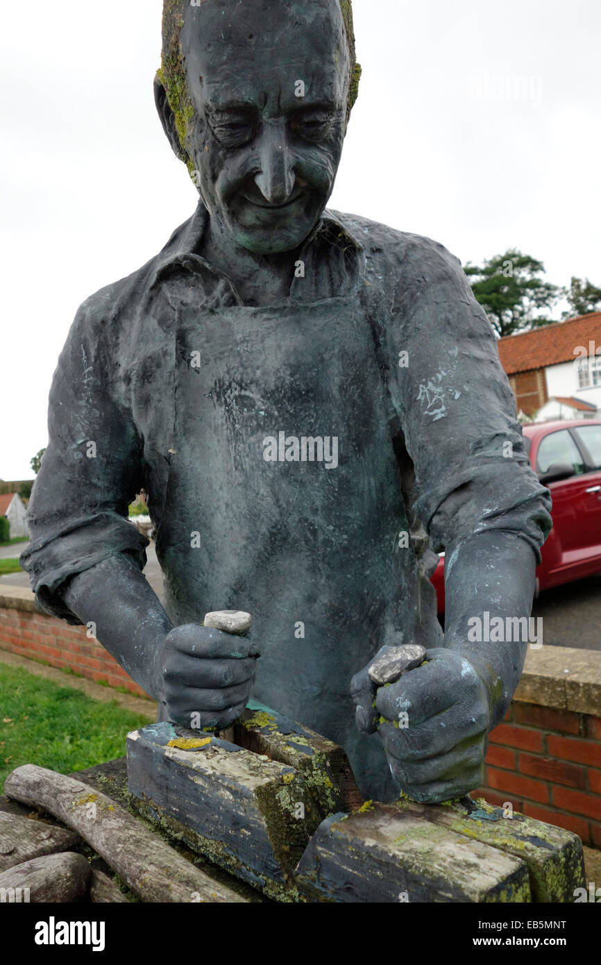 Sculpture of a wherry builder on the banks of the river Yare at Reedham Stock Photo