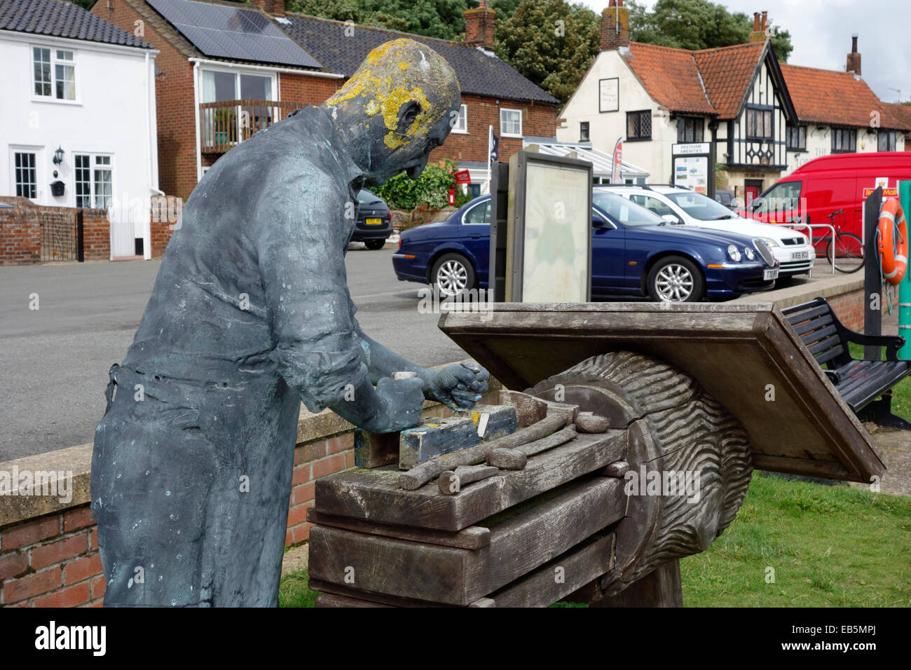 Sculpture of a wherry builder on the banks of the river Yare at Reedham Stock Photo