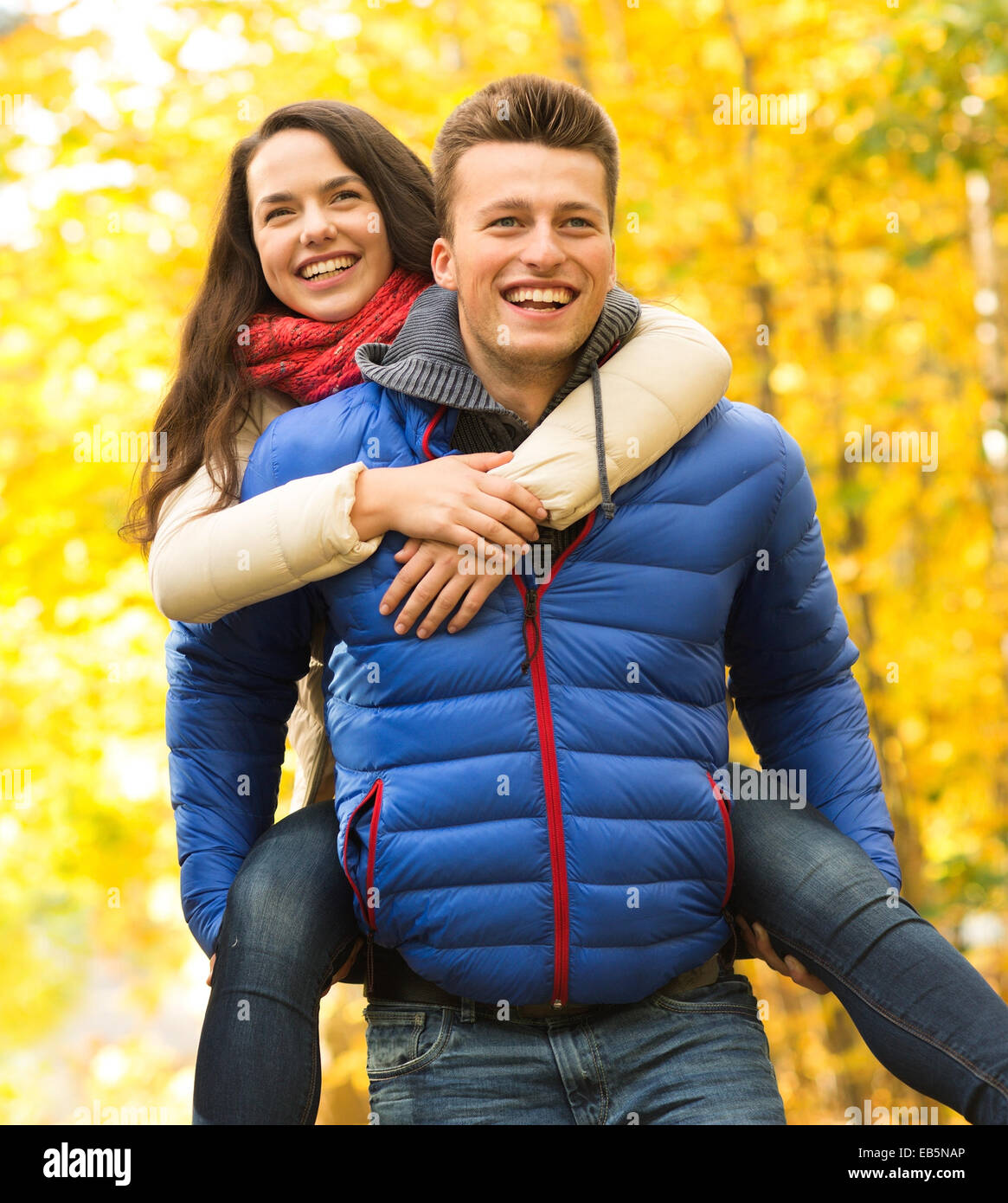 smiling friends having fun in autumn park Stock Photo - Alamy